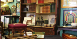 Antiques, Collectibles, Or Vintage Items Including Vintage Books, Antique Furniture, Luggage, And Framed Art On Display By Dealer 26 At Warson Woods Antiques Gallery In St. Louis.